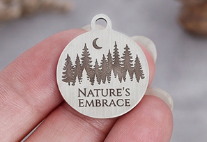 Pendant engraved with a forest design