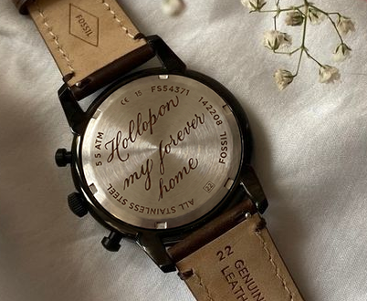 Personalized lettering engraved on a watch
