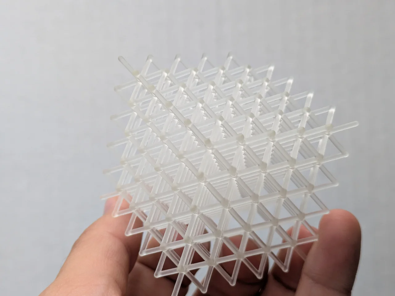 Transparent resin lattice demonstrating fine open geometry