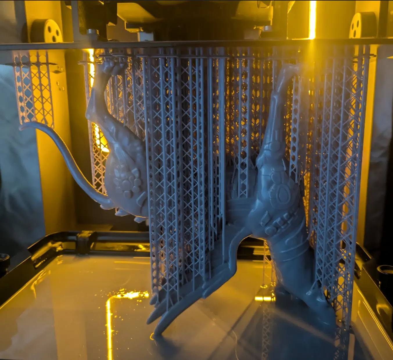 Detailed resin parts on their build supports